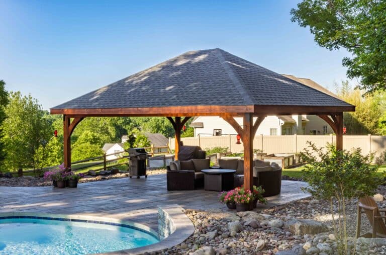 Projects 1 View of Cheyenne Wooden Pavilion besides pool with seating underneath