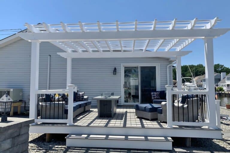 Projects 8 View of 10x16 Vinyl Carolina Pergola on deck outside home