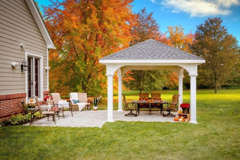 Projects 3 White Vinyl Montford Pavilion over patio seating area in fall backyard