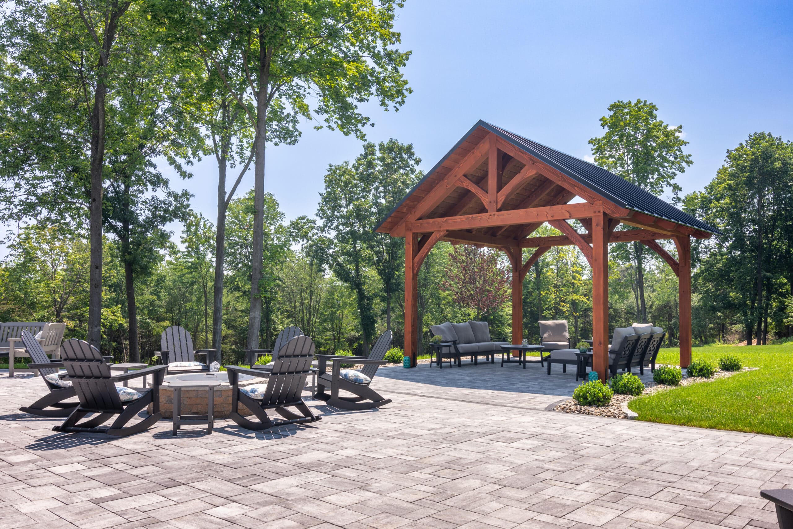 The Kingston pavilion to the right of patio seating area with seating underneath