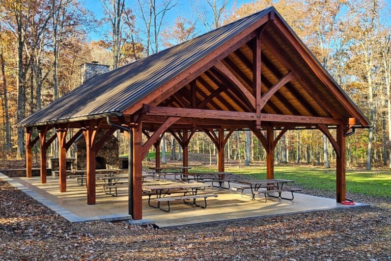 Projects 8 View of 30x50 kingston pro pavilion in woods with patio