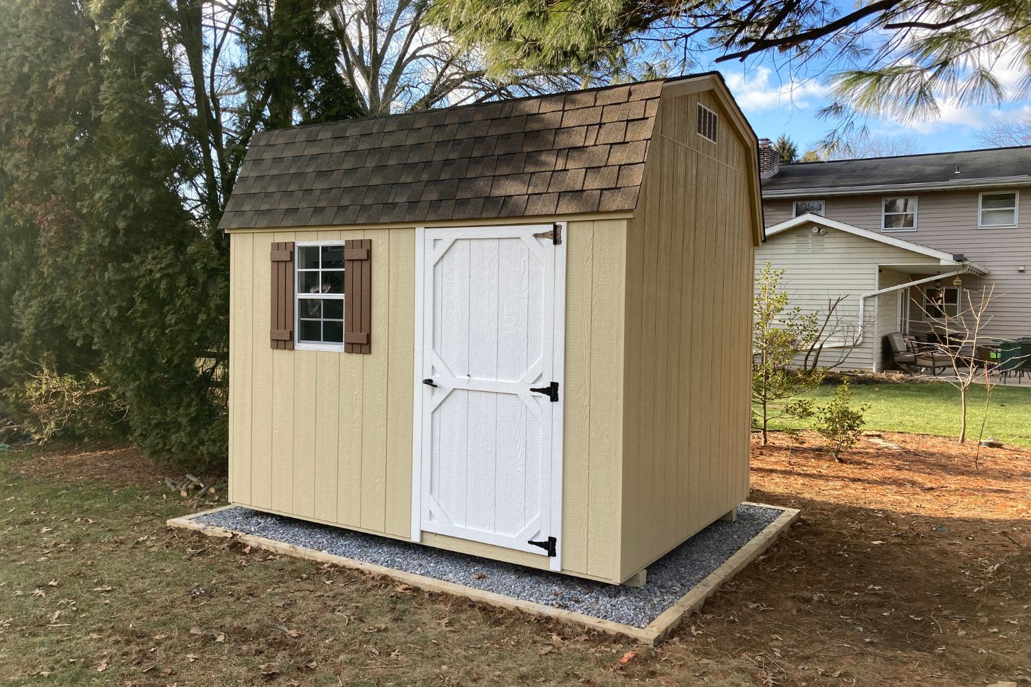 8x10 Standard Wood High Barn 1 Light Brown standard high barn in backyard on gravel pad