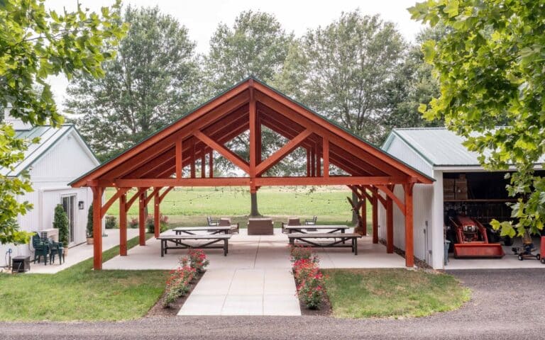Projects 7 Aeriel view of front of 38x30 Kingston Pro TImber Frame pavilion between two white buildings.