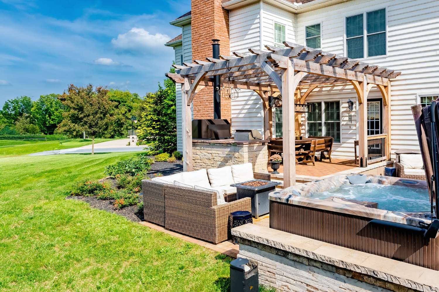 Boulder Wooden Pergola over seating and grill area