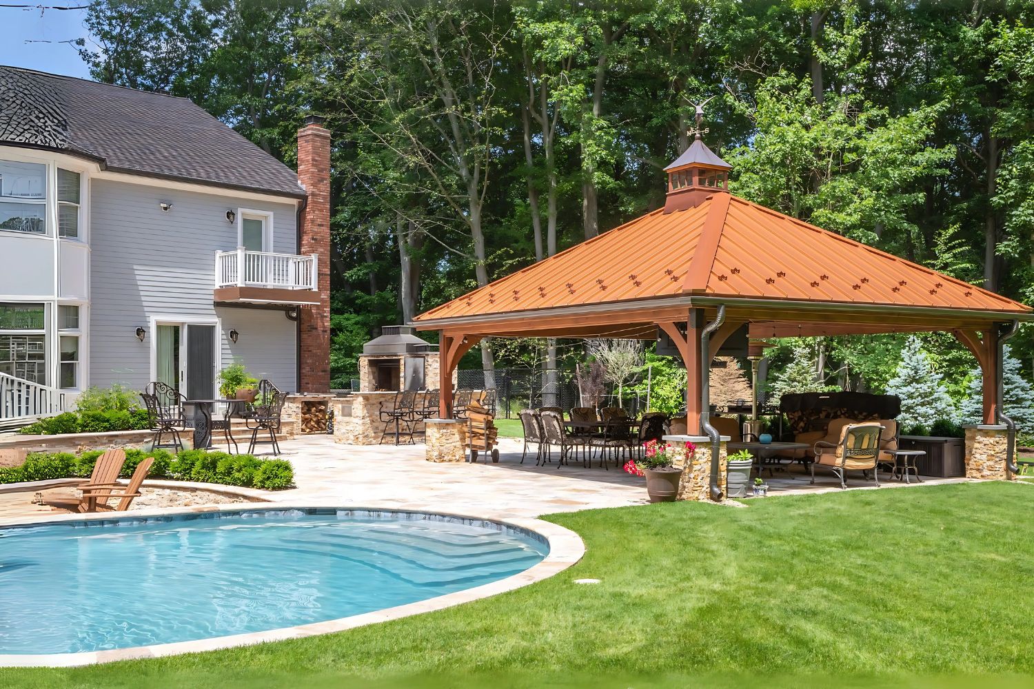 Cheyenne Pavilion with metal roof, besides pool with seating underneath