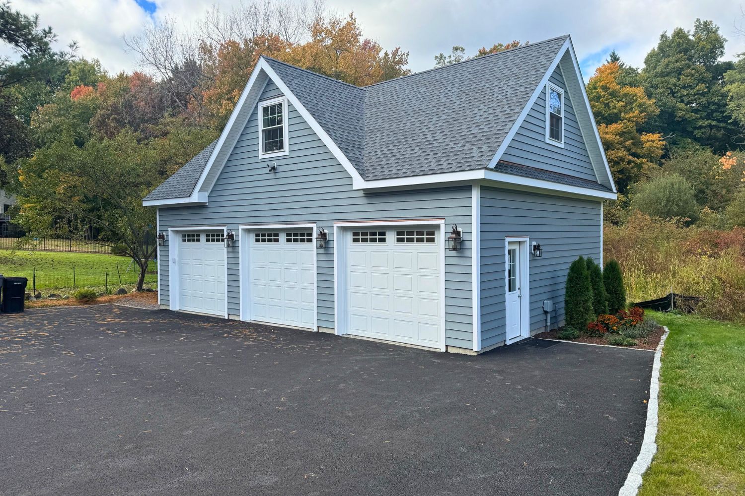 A-Frame Empire Garage on driveway with blue-gray siding and white trim