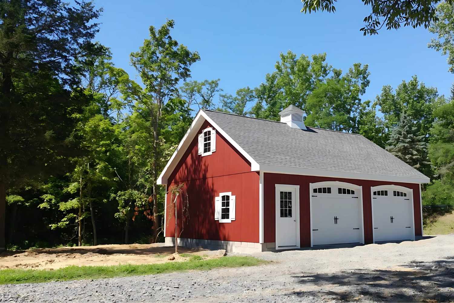 Red Attic series garage with white doors, cupola, windows, and trim