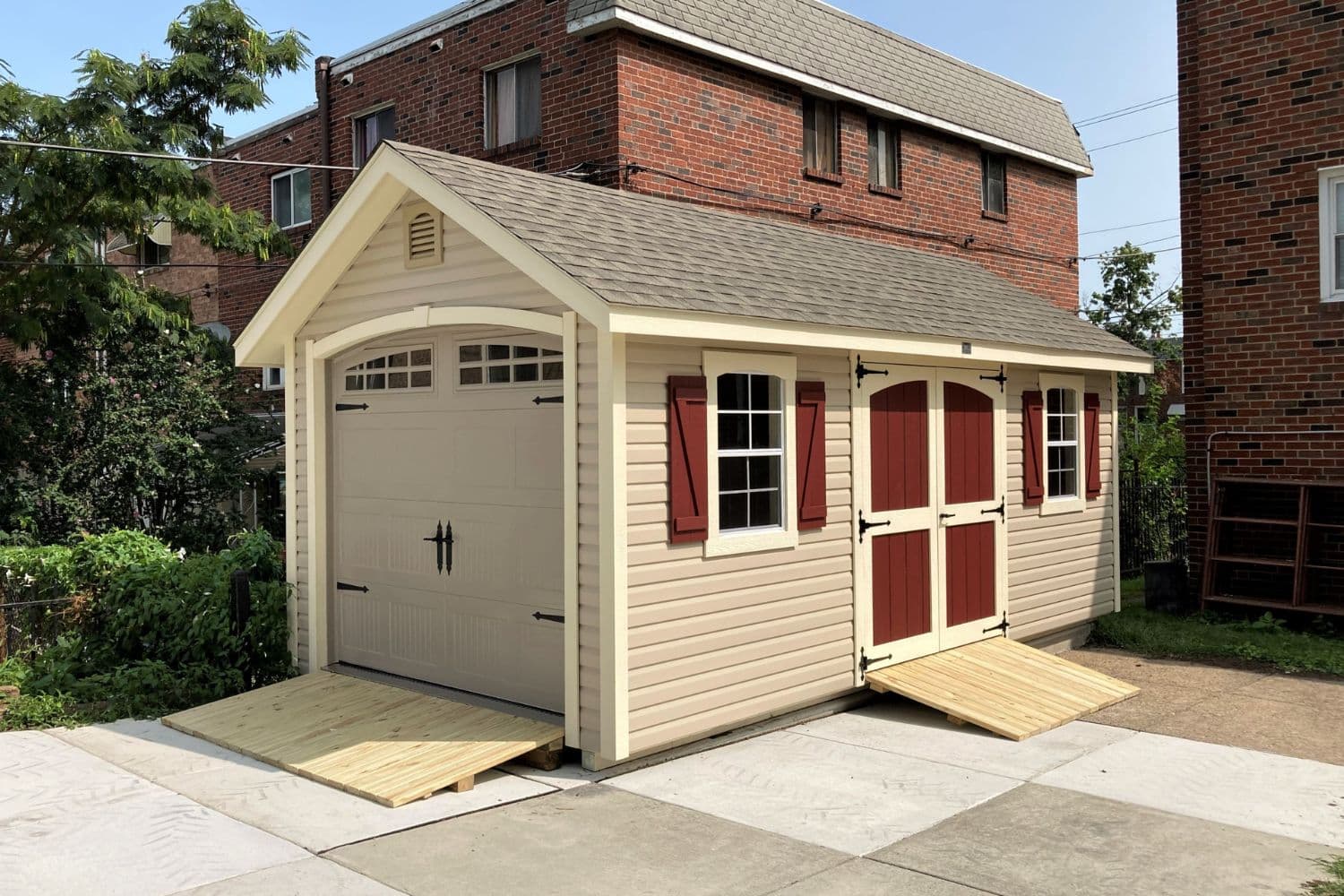 Vinyl exterior on designer workshop garage shed in backyard on concrete pad