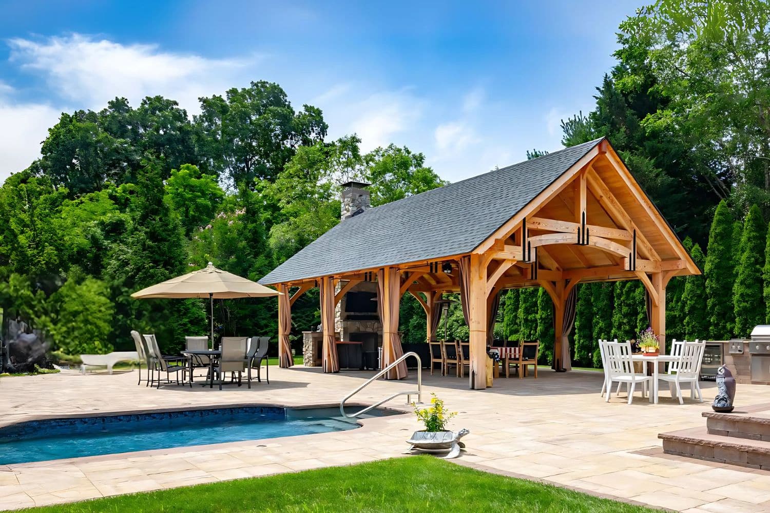 The Grand Teton Pavilion 4 The Grand Teton Timber Frame Pavilion besides pool and seating areas